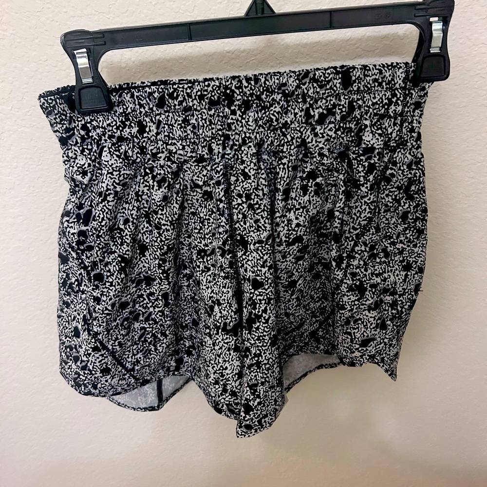 Lululemon size 4 Black, grey, and cream 4 inch Hotty Hot shorts. Slightly used